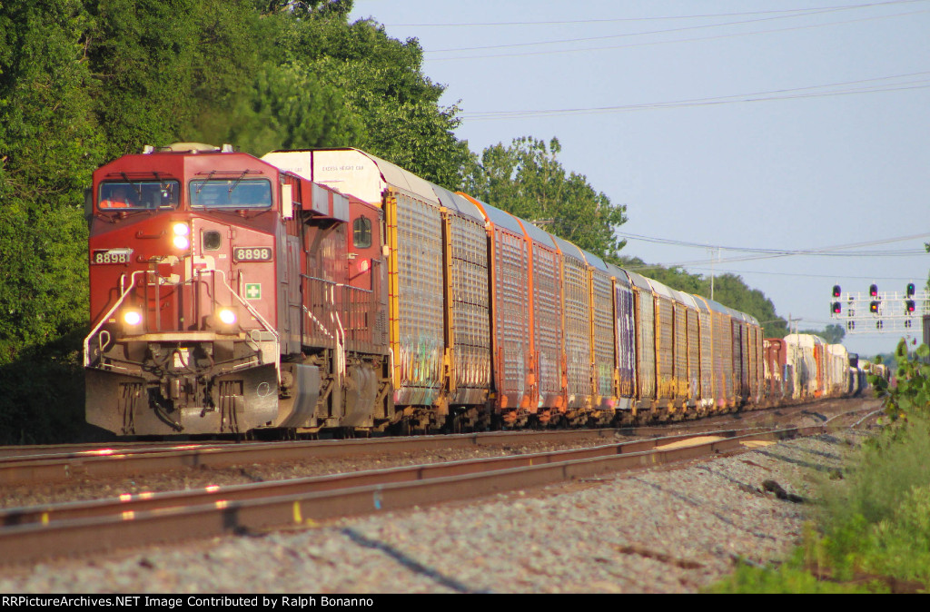 CP train 131 westbound just east of downtown in the afternoon sun 